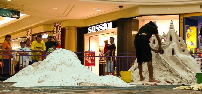 Sand sculpture installation in shopping center.